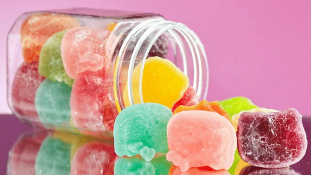 Bocal rempli de bonbons illustrant les envies de sucre liées au stress et les compulsions alimentaires, accompagnement LaserAddict en réflexo-auriculaire au laser doux.